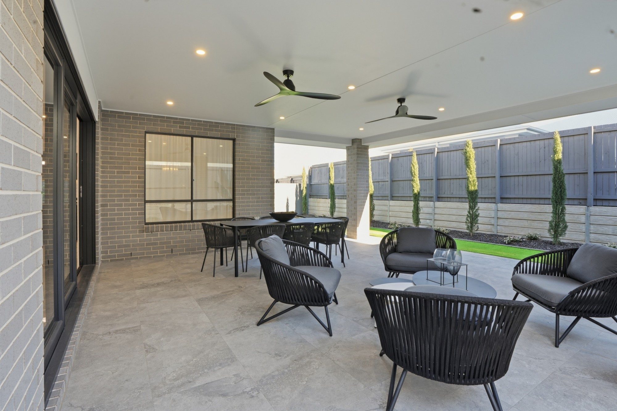 Covered alfresco with outdoor lounge and dining beside the garden