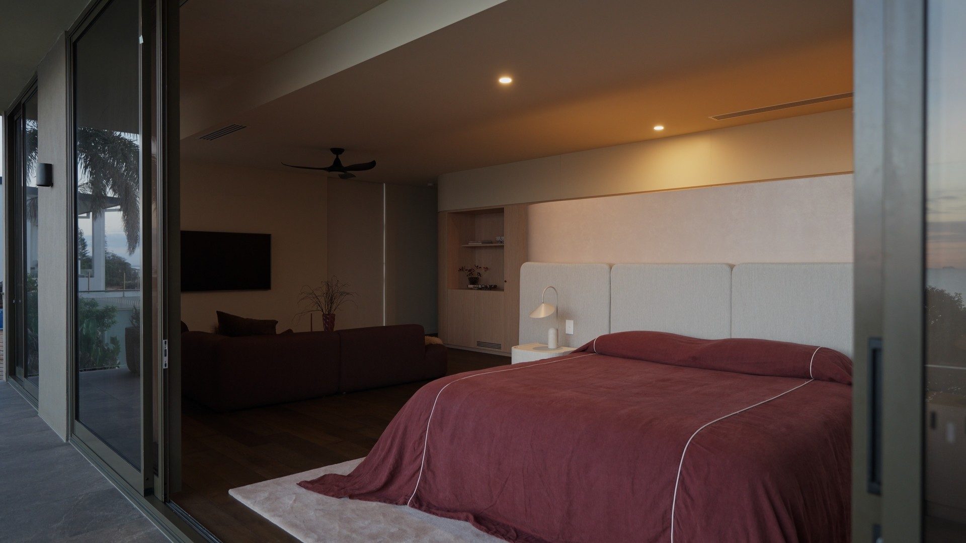 Master bedroom at Horizon by Graya at dusk, seen from the balcony