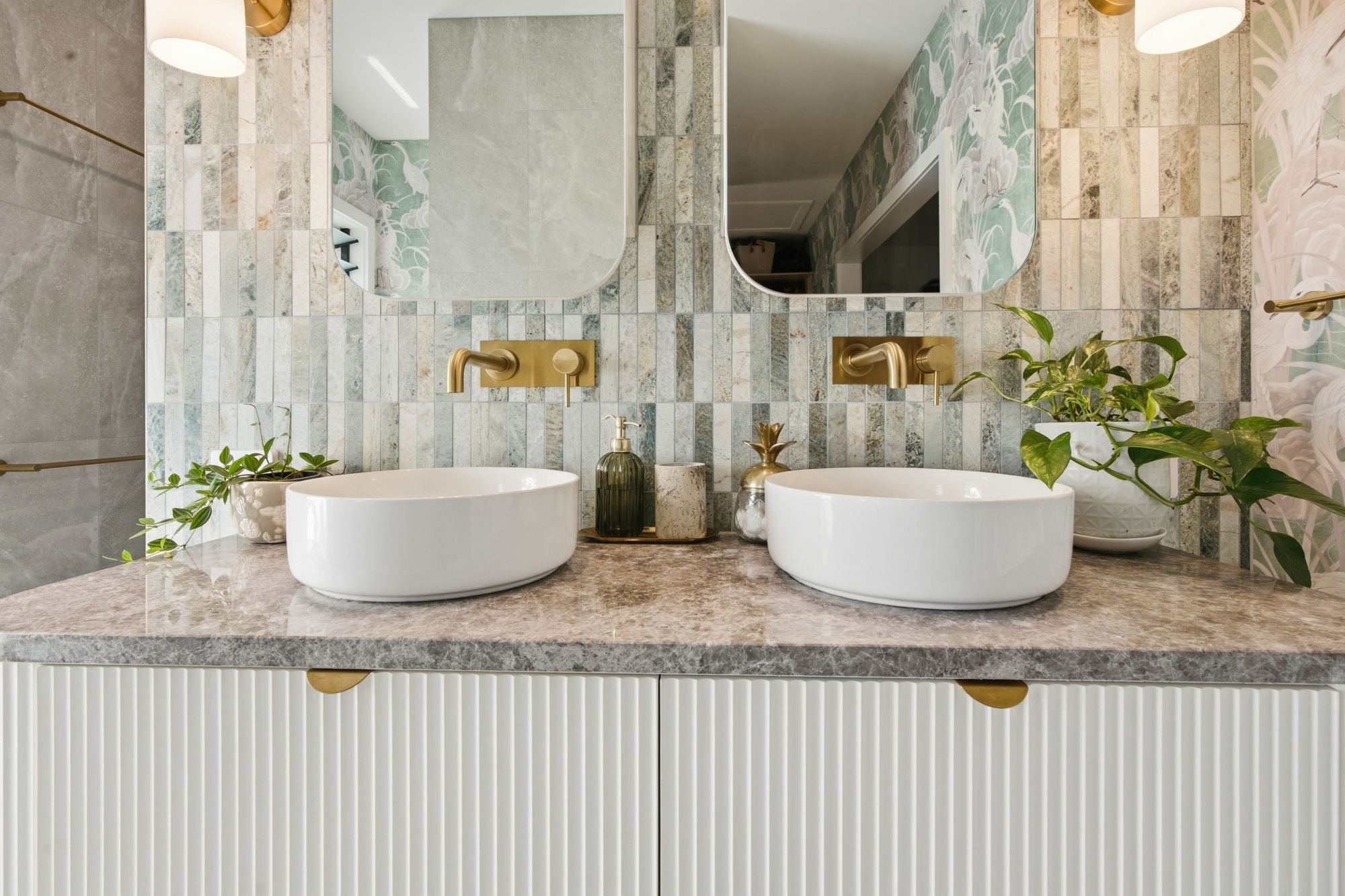 Double vanity with brushed brass tapware, renovated by Masterkraft Renovations