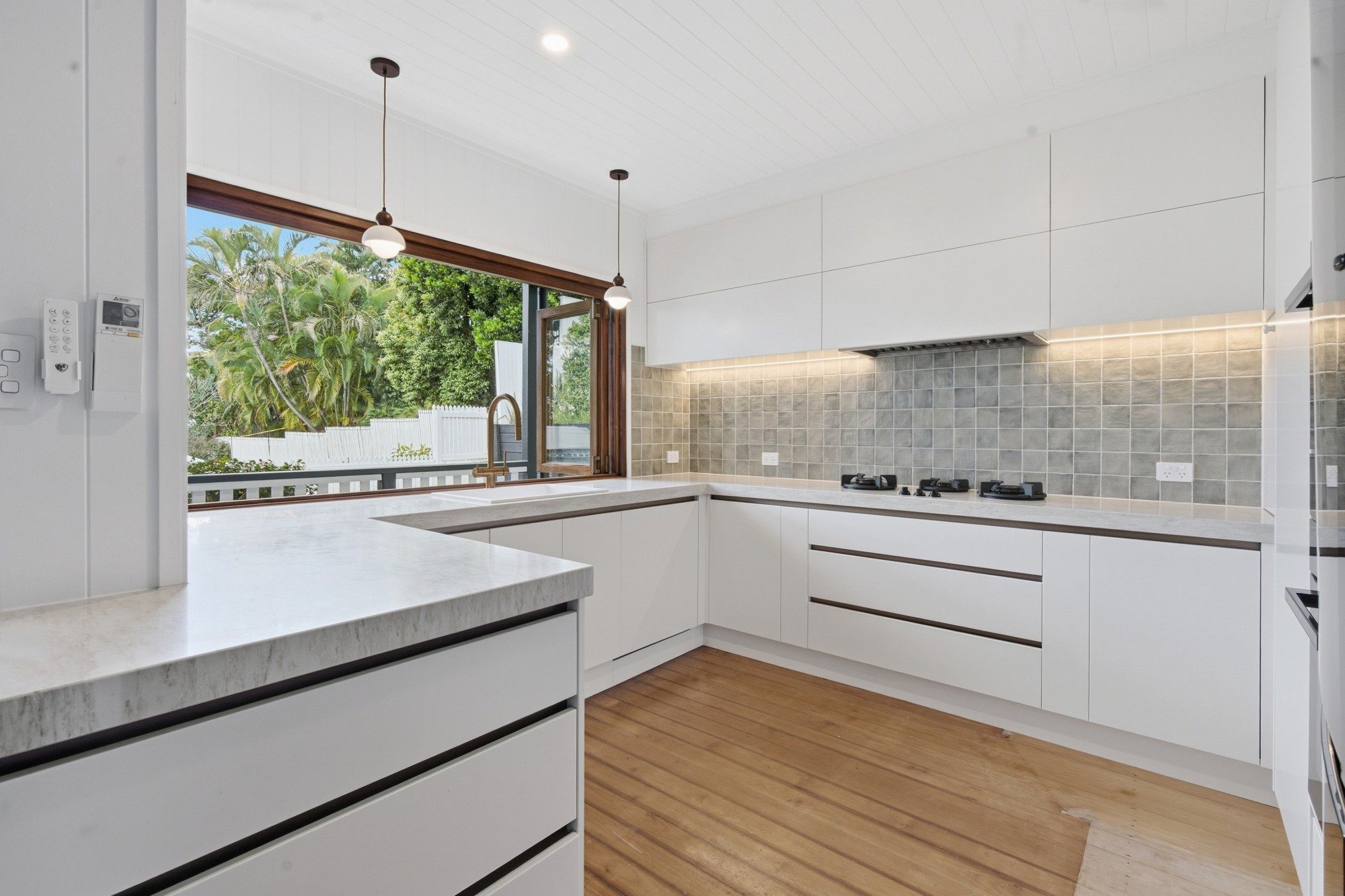Renovated kitchen by Masterkraft Renovations, photographed by Highmark Media
