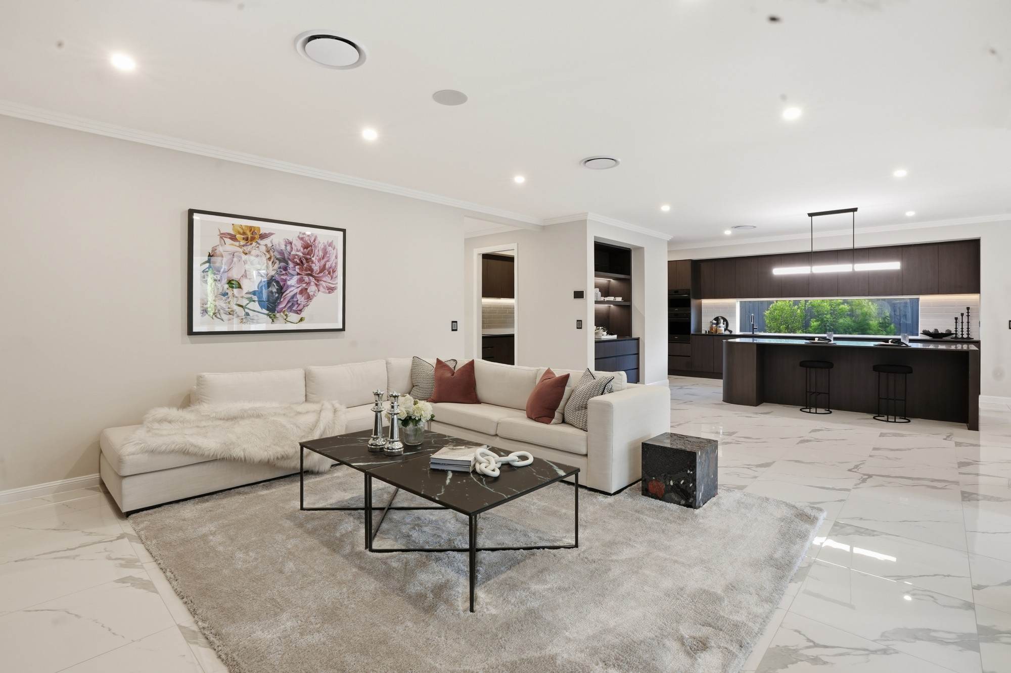 Open-plan family room flowing through to the kitchen and dining